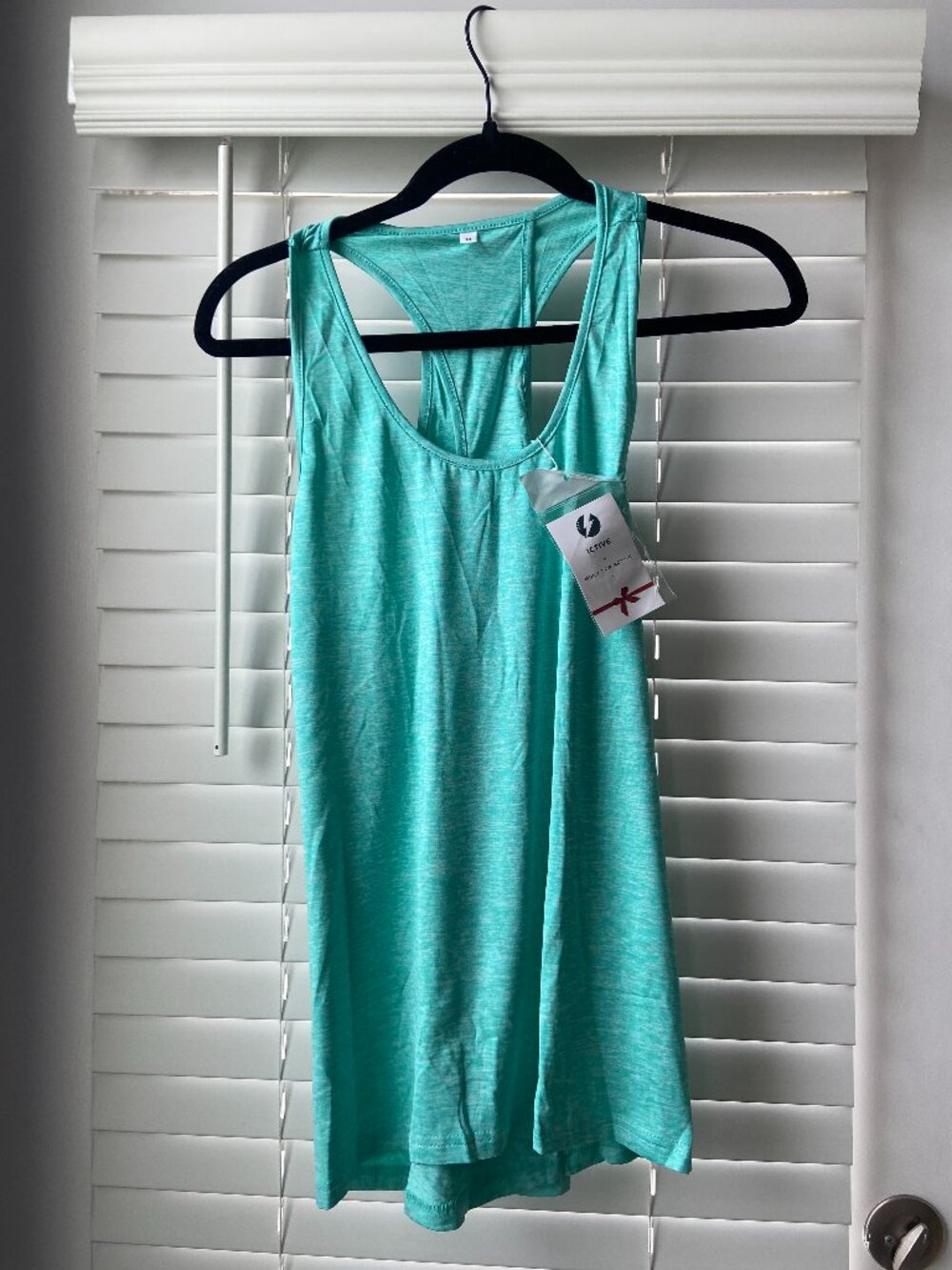 Teal activewear tank top with keyhole razorback